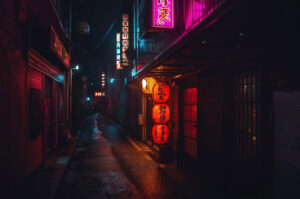 Dark, wet Japanese alleyway at night illuminated by red paper lanterns and bright pink and blue neon signs.