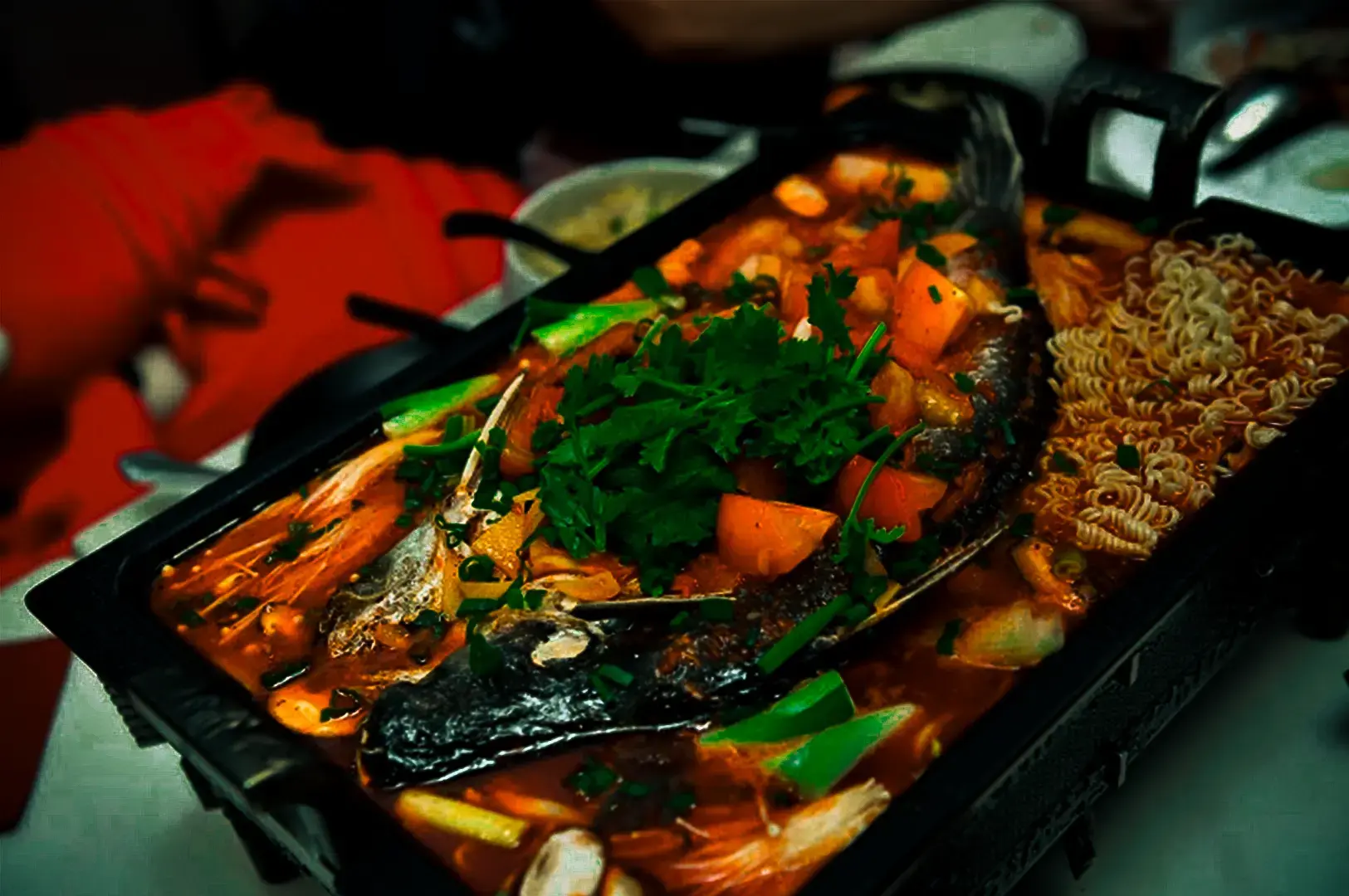 Grilled fish with Sichuan and chili pepper infused broth served at 6ix 6ix, Cuppage Road.