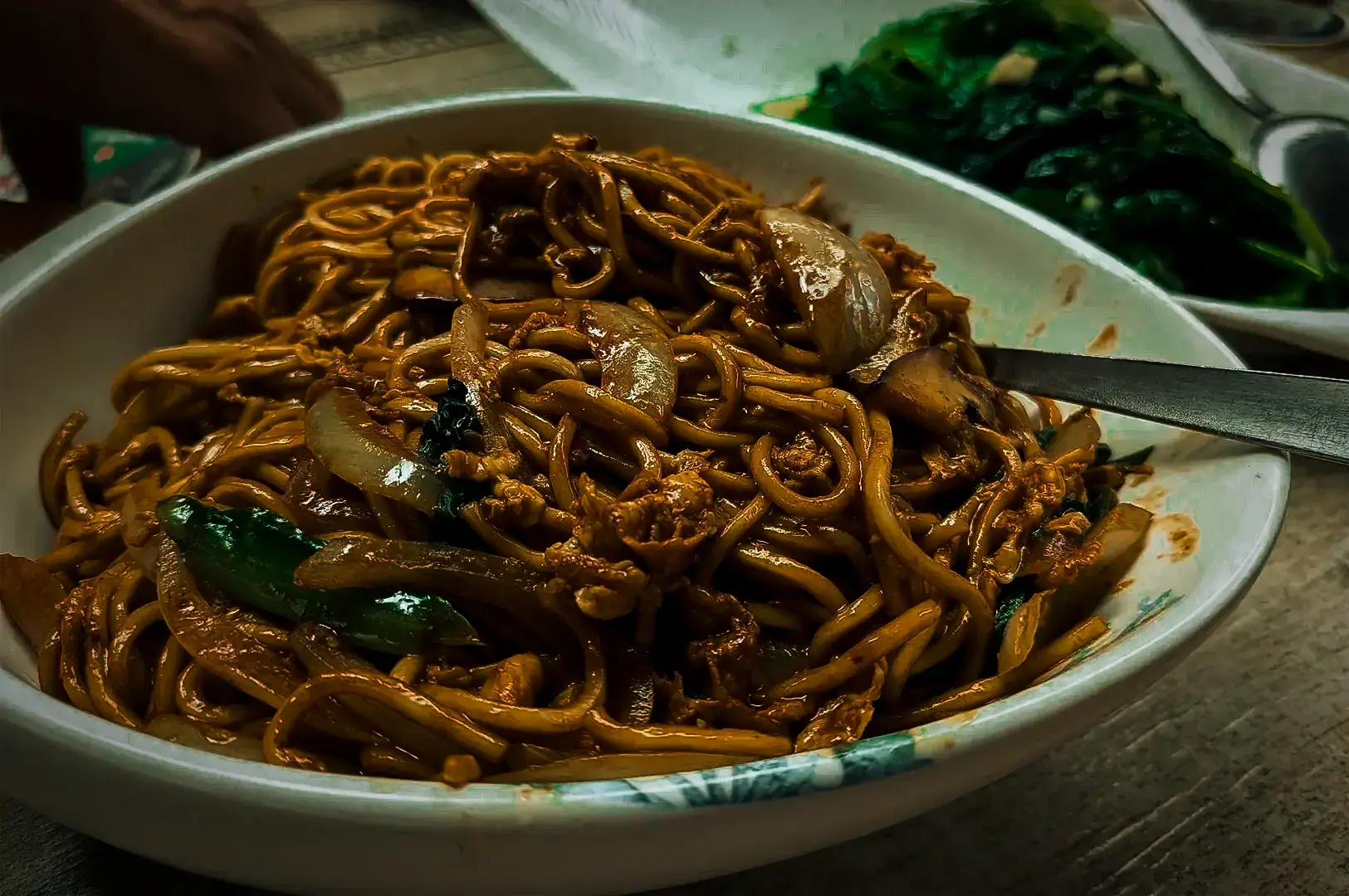 Egg fried noodles with pork, onions and vegetables served at 6ix 6ix, Cuppage Road.