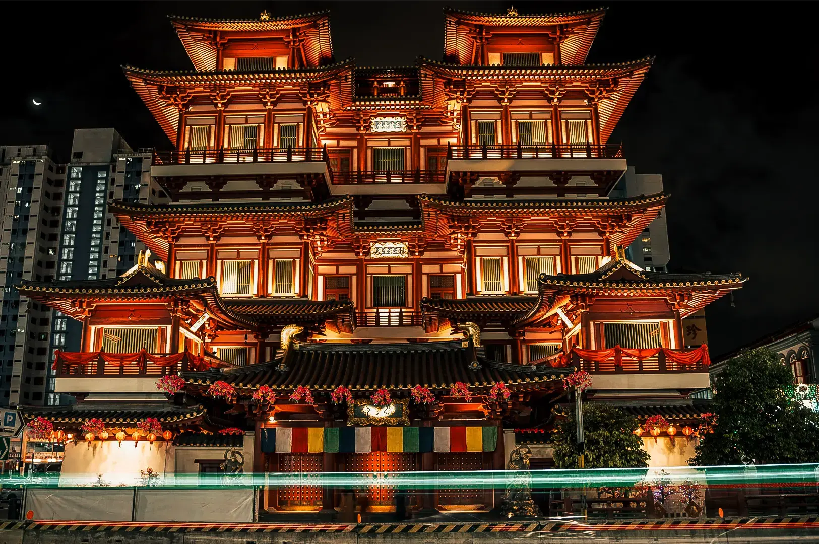 Famous Buddha Tooth Relic Temple during night located in Chinatown Singapore featuring its distinct Chinese architecture.