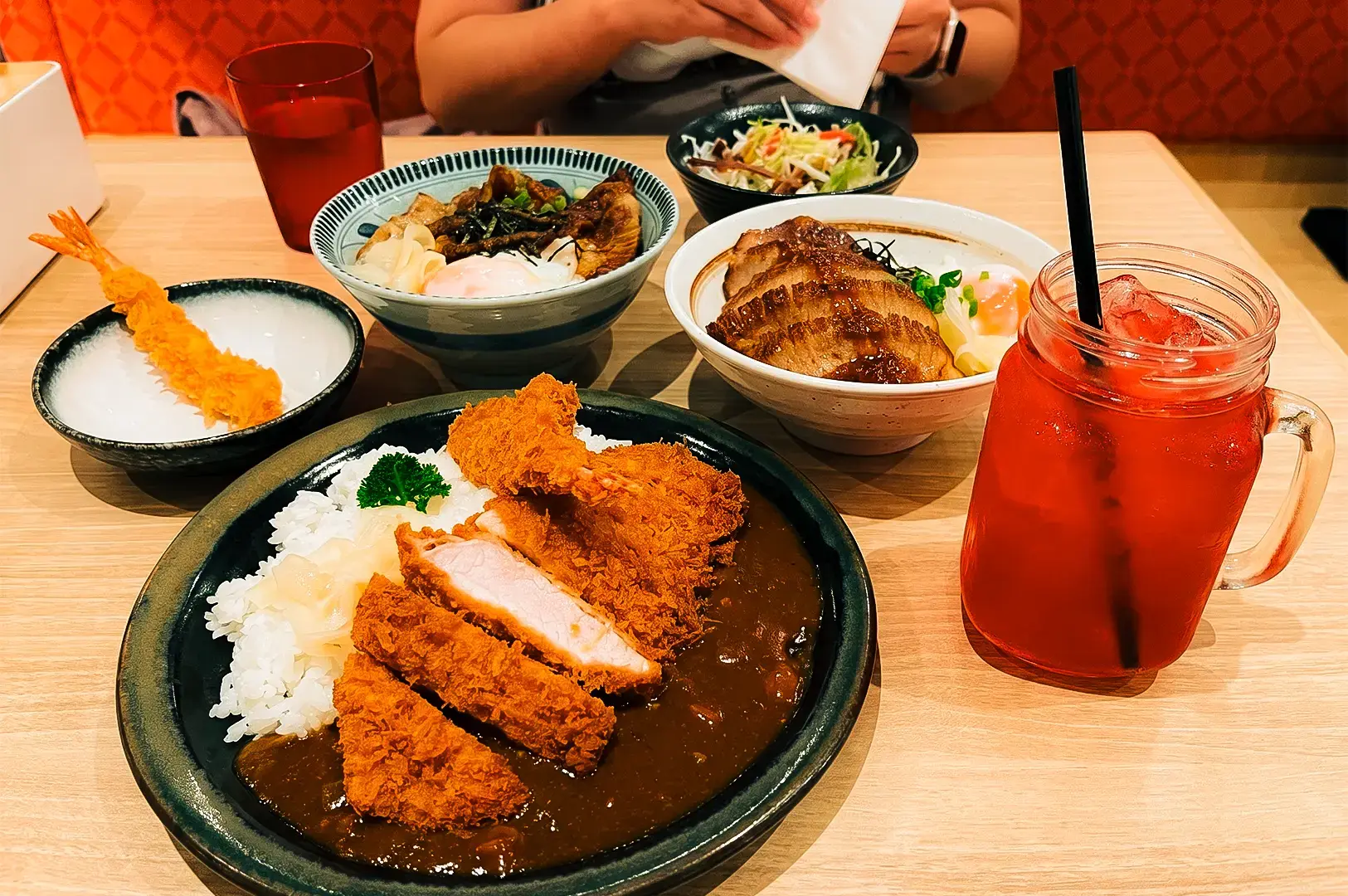 Gochi-So Shokudo menu items spread out in a table including katsu, tempura, rice, and more.